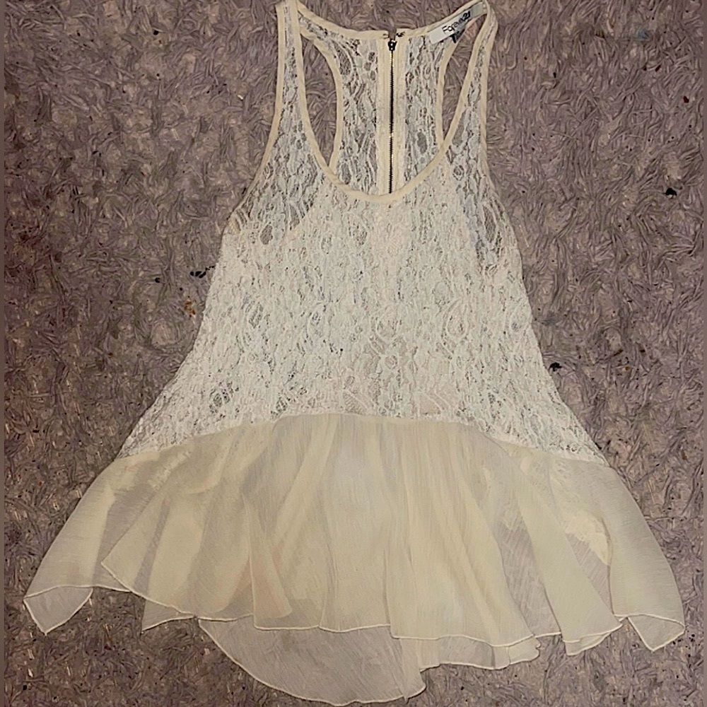 Dressy, beautiful and wavy beige tank top with netting on top.    Size: Small